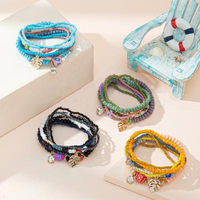 China Newest Vintage Boho Jewelry Sets Shape Colorful Eye Leaf Flower Charm Round Seed Bead Elastic Bracelets Set Women Wholesale for sale