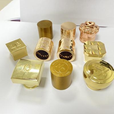 China Non Spill Porcelain Factory Design Cosmetic Luxury Zinc Alloy Perfume Capsule Top Shape for sale