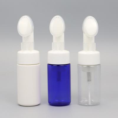 China Non spill wholesale plastic bottle with foam pump tops and silicone brush cap for beauty care for sale