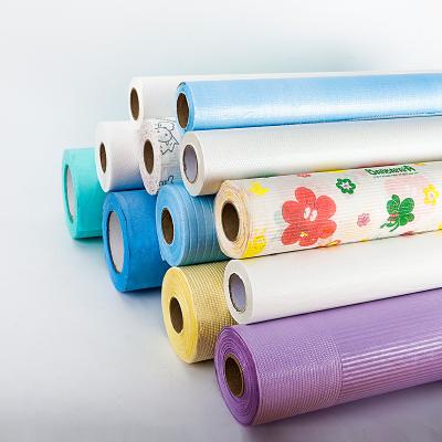 China Dental Clinic Disposable Perforated Nonwoven Soft Paper Roll Massage Table Sheet Roll for sale