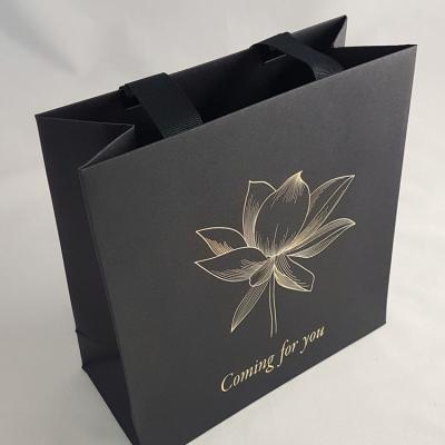 China Recyclable Wholesale Custom Printed Black Luxury Shopping Paper Gift Bag With Handle for sale