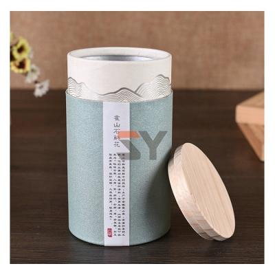 China Handmade food grade round empty airtight container paper tube tea box, custom paper tube with wooden lid for sale