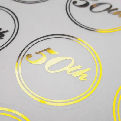 China Customized Printing Clear Stickers Waterproof Self Adhesive Logo Transparent Gold Foil Label for sale