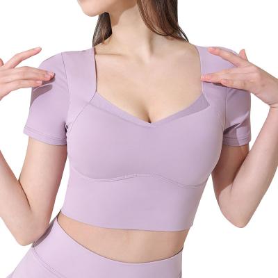 China Breathable Mesh Insert Compression Elastic Quick Dry Yoga Women T-Shirt With Pads for sale