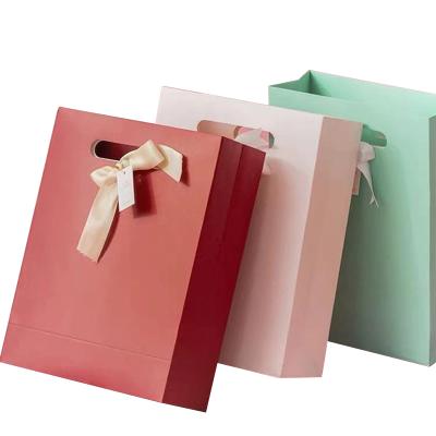 China High Quality Recyclable Kraft Paper Packaging Bag With Handle Gift Packaging Bag Brown Paper Bags Butterfly Shopping Festival for sale