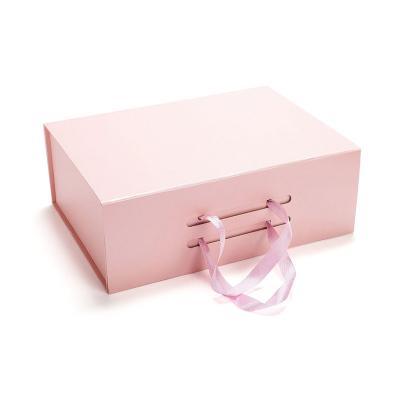 China Recycled Materials Wholesale Custom Luxury Pink Paper Folding Cardboard Logo Design Handmade Cosmetic Box Gift Box With Handle for sale