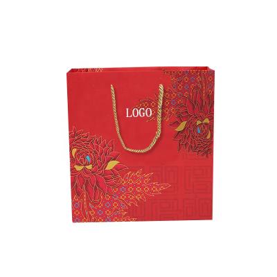 China Brand New Recyclable Custom Logo Kraft Paper Bag Red Shopping Paper Bag With Cotton Rope Handle for sale