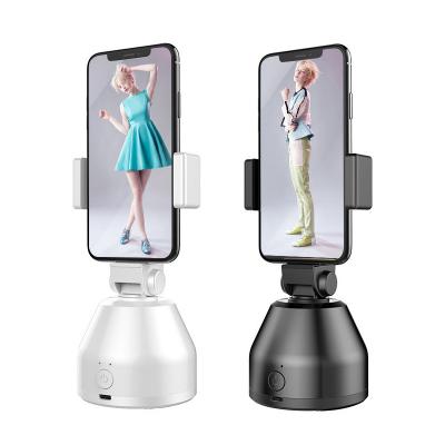 China 2021 PORTABLES New Automatic Face Lane Phone Holder 360 Degree Rotation Phone Holder For Tiktok Vlog Live Streaming Rechargeable for sale