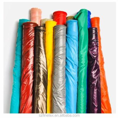 China New Water Resistant Material 100%Polyester 300T 50D 72F Multi Filament Taffeta Fabric Oil Wax For Padded Down Coat Duck Down Jacket for sale