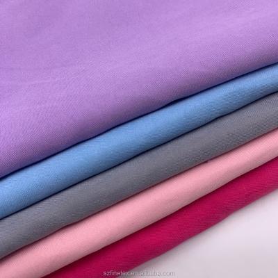 China Manufacturers Anti-Static Brushed Polyester Twill Micro Fiber Peach Skin Cloth Material Fabric For Beach Shorts Coats Jacket for sale