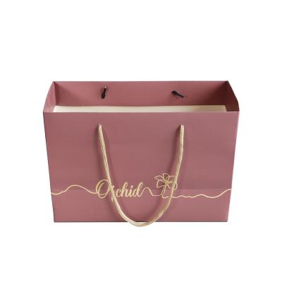 China Recyclable Luxury Custom Paper Bag Logo Gold Hot Stamping Boutique Matte Pink Shopping Gift Packaging for sale