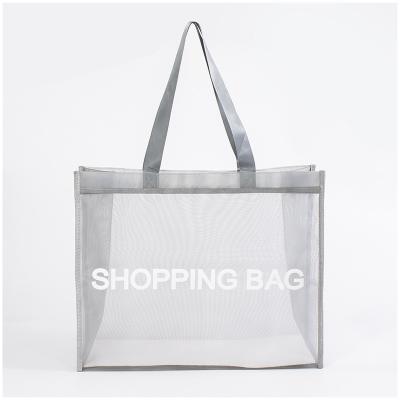 China Durable Wholesale Portable Beach Bag Letter Printing Nylon Breathable Transparent Mesh Shopping Bag for sale