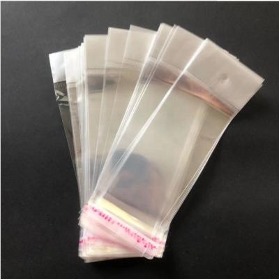 China High quality clear opp shipping plastic bag with adhesive sticker and header for wig packaging for sale