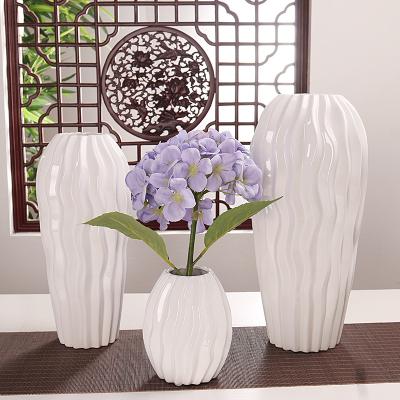 China Modern Creative Vase Hand-carved Modern Minimalist Ceramic Vase Water Wavy Vase for sale