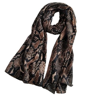 China 2021 autumn and winter snake pattern cotton hemp scarf women hemp quality new European and American printed scarf beach towel wholesale for sale