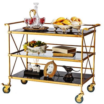 China (Other) Zhongshan Manufacture Adjustable Brass And Movable Push Type Modern Dining Car Furniture Wine Food Luxury Black Marble Tea Trolley for sale