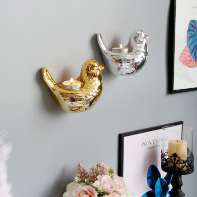 China Europe best selling personalized Nordic style wall hanging bird candle holder household metal candlestick decorations for sale