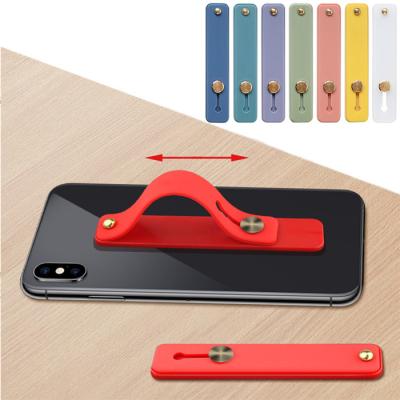 China Adjustable Silicone Hand Band Holder Finger Strap Loop Holder Mobile Phone Grips LOGO Finger Grip Phone Holder Custom for sale