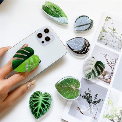 China New Customized Adjustable Logo Plant Leaves Finger Mobile Phone Grip Holder With Acrylic for sale