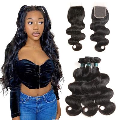 China Unprocessed Indian Remy Virgin Human Hair Extensions 9A Body Wave Hair Bundles With Closure for sale