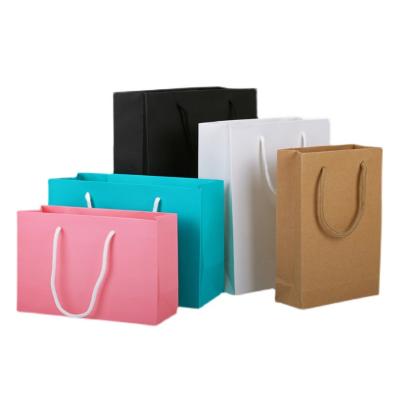 China Recyclable Wholesale Custom Printed White And Brown Paper Kraft Gift Apparel Shopping Bags With Your Own Ribbon Handle Logo for sale