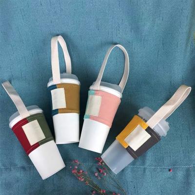 China Kpop Cotton Canvas Fabric Waterproof Coffee Mug Carrier Eco-Friendly Takeaway Reusable Coffee Cup Sleeve With Custom Logo