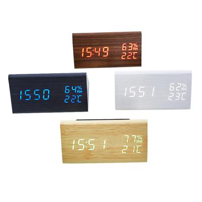 China Creative Wireless Time Temperature Control Voice Calendars Digital LED Wooden Alarm Clock Speaker for sale