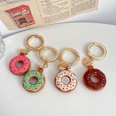 China Cute Anti-drop Cartoon Donuts Case For Airtag Case Silicone Cover Device For Apple Airtag Case With Keychain for sale