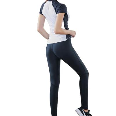 China Seamless Yoga Anti-Static Hot Sale Women's Yoga Set Solid Color Legging And Bra Crop Top Running Sportswear for sale