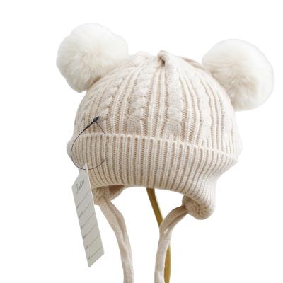 China Plush Winter Warm Baby Knitted Hat Kids Boy Girl Earmuffs Hat Pompom Fur for sale