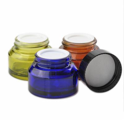 China Cosmetic 15/30/50g Round Oblique Shoulder Glass Jar With Blue/Brown/Green For Body Cream for sale