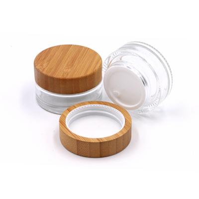 China 5g 15g 30g 50g 100g skin care cream stocks engraved/printers the clear logo/gel cosmetic glass jar with bamboo/wooden lid for cream container for sale