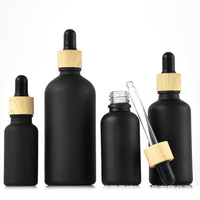 China High Quality Matte Black Frying Oil Essential Oil 5/10/15/30/50/100ml Bottle Dropper Bottles With Wooden Dropper for sale