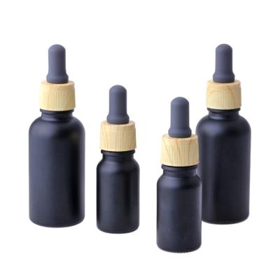 China High Quality Black 10ml 30ml Glass Dropper Bottles Of Frying Oil,Essential Oil Bottle With Wooden Dropper for sale