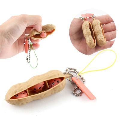 China Key Chain Squeeze Dangling Peanut To Release Pressure Toy Key Chain Fidget Sensory Toys for sale