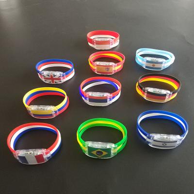 China 2022 Promotion Giftts World Cup LED Bracelet Glow Flag Wristband Silicone Cheering Fan Led Glow Watch Light Up Soccer Team Cheer Props New for sale