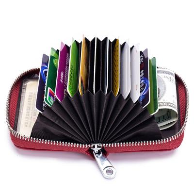 China Credit Card Leather Brush Anti-theft Fashion Organ Card Holder Zipper Magnetic Male Leather Bag for sale