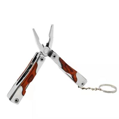 China Material: stainless + wooden multifunctional pliers with wooden handle for sale