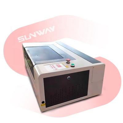 China Interesting 40w 50w 3020 water cooled and premium quality name plate co2 laser cutter metal strip engraving machine no for sale