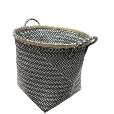 China Sustainable Hand - Color Nordic Decorative Black White Round PP Woven Belt Storage Basket Laundry Hamper Durable Toy Container for sale