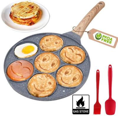 China Viable 10 Inch Pancake Pan With 7 Holes Oatmeal Cookie Faces For Breakfast Griddle Fried Egg Pan for sale