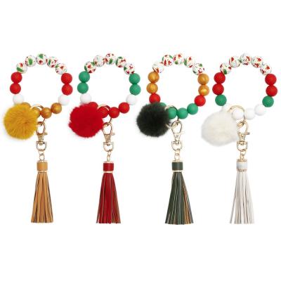 China Promotion Christmas Gifts Key Ring Bracelet Wristlet Keychain Silicone Advertising Beaded Bracelet Pom Pom Tassel Keyring for sale