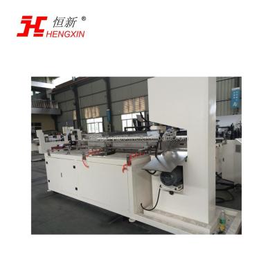 China Hengxin automatic cutting machine for toilet paper roll / napkin tissue paper with strip saw type HX-450 for sale