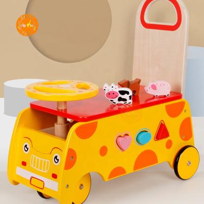 China Ride On Toy Wooden Cartoon Car Early Education Play Toy Car Kids Interactive Imitate Walker Giraffe Toddler Walker for sale