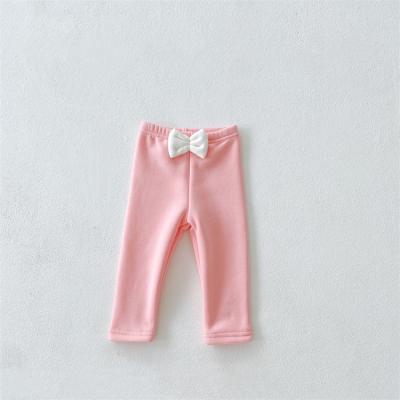 China Anti-wrinkle baby clothes winter plus solid color thick bow leggings new velvet long pants all-matching baby boy clothes for sale