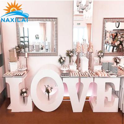 China Hot Easy Supply Best Assembly NAXILAI Rack Alphabet Letter Cake Table For Birthday Party Decorations for sale