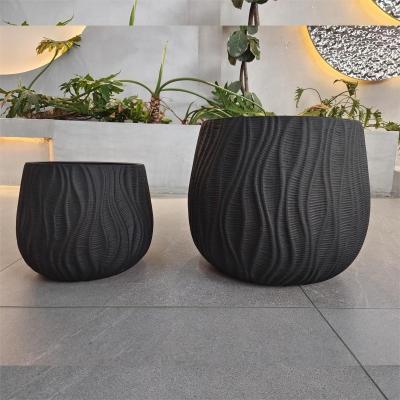 China Modern Round Heavy Fiber Clay Planter Hand Carved For Home Garden Decor for sale