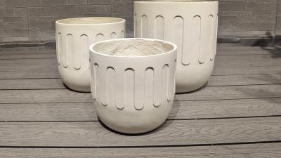 China Striking Modern Fiber Clay Planter with Drainage for sale