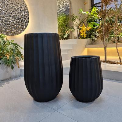 China Upgrade Gardening Game With Our Stylish Fiber Clay Planter Collection for sale