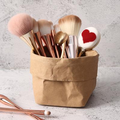 China Sustainable Washable Kraft Paper Bag Customized Creative Gift Cosmetic Pen Container Storage Bag No Handles for sale